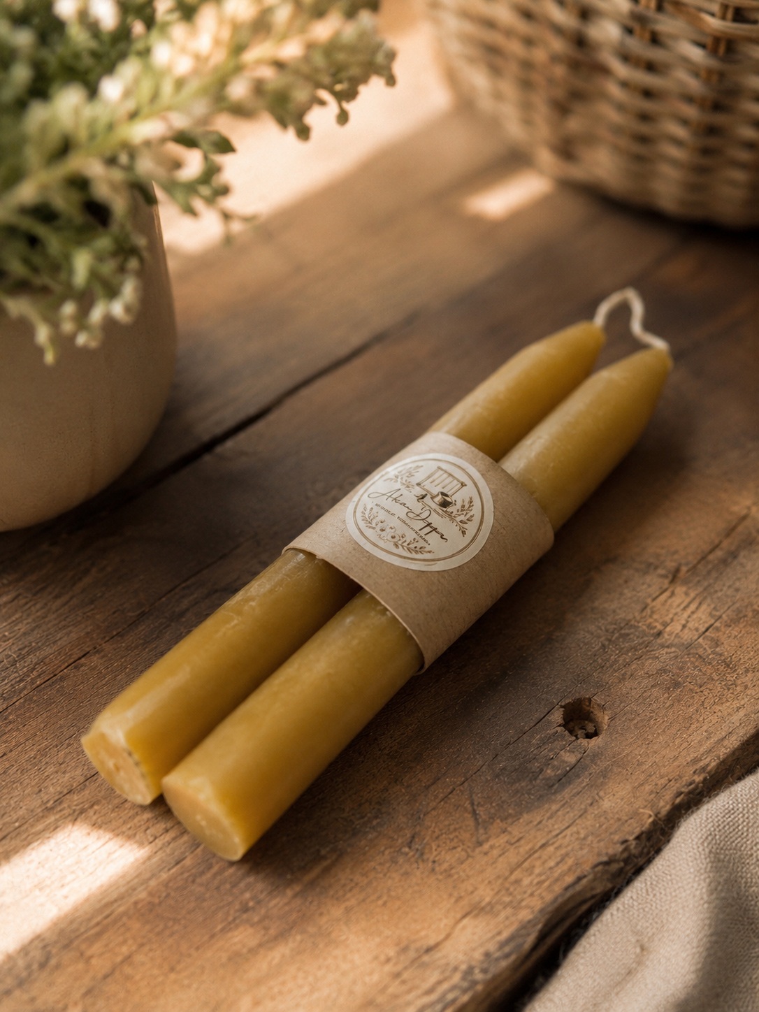 Bundle of golden hand-dipped pure beeswax taper candles
